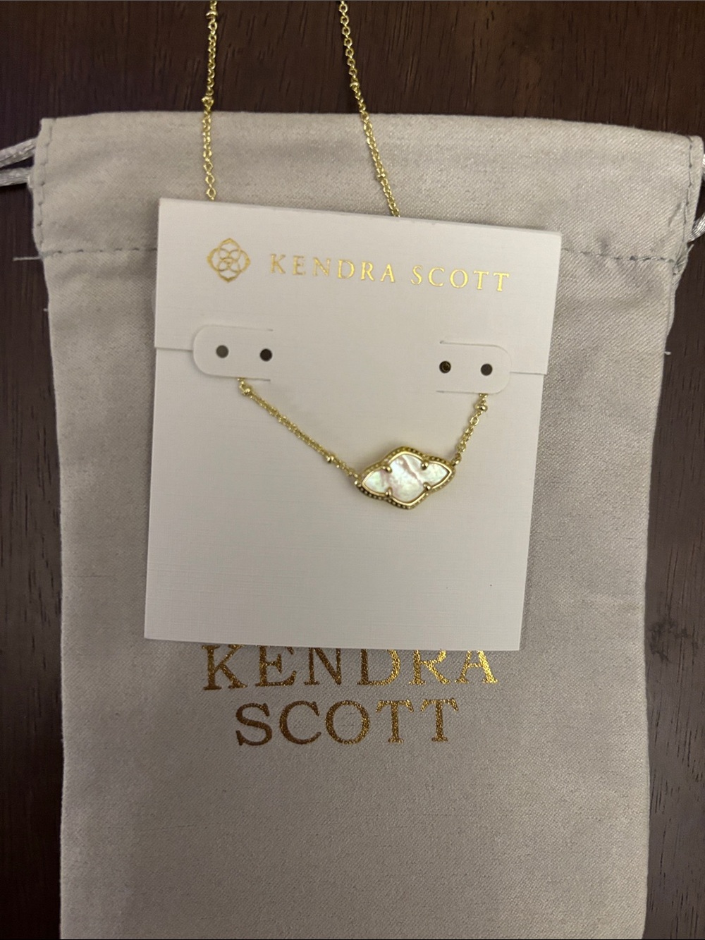 Brand new Kendra Scott Gold Necklace with White Iridescent Stone